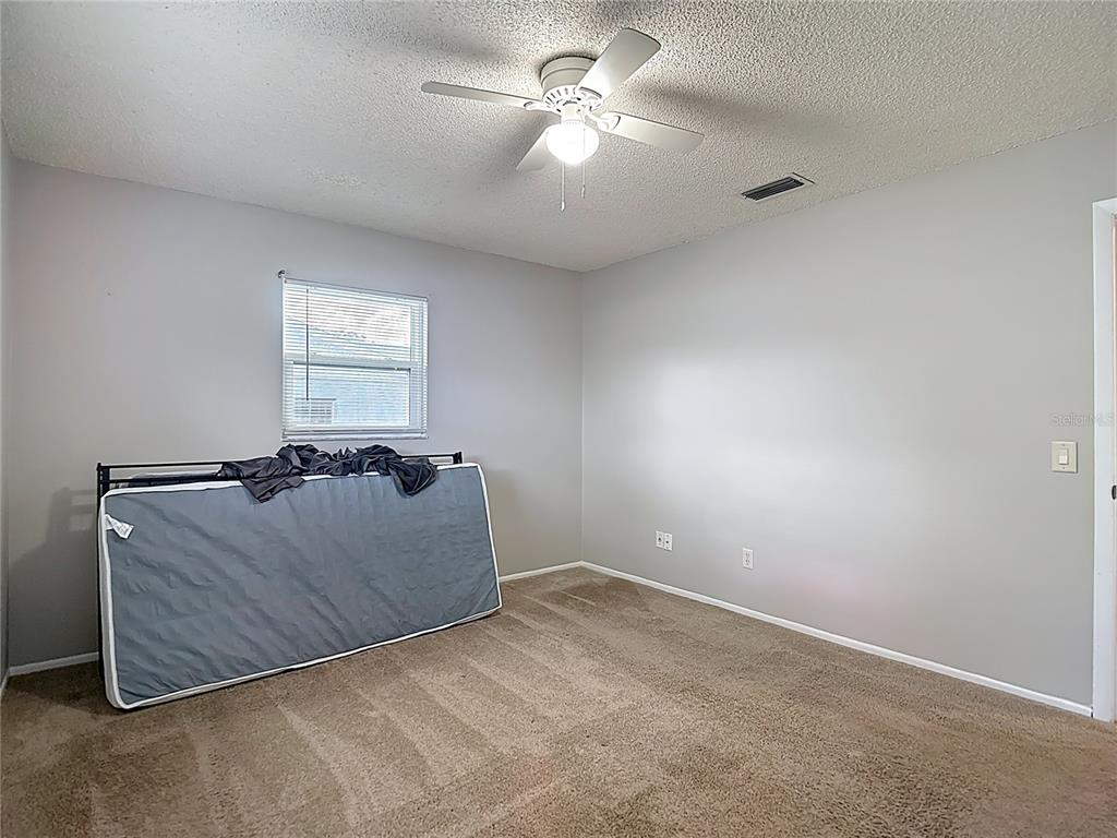 7318 Tranquil Drive Spring Hill, FL 34606 - Photo 23 of 31 a living room with furniture and a window