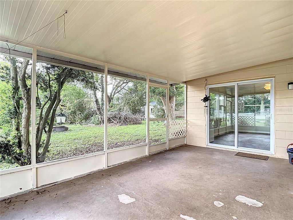 7318 Tranquil Drive Spring Hill, FL 34606 - Photo 28 of 31 a view of a room with sliding glass door and balcony