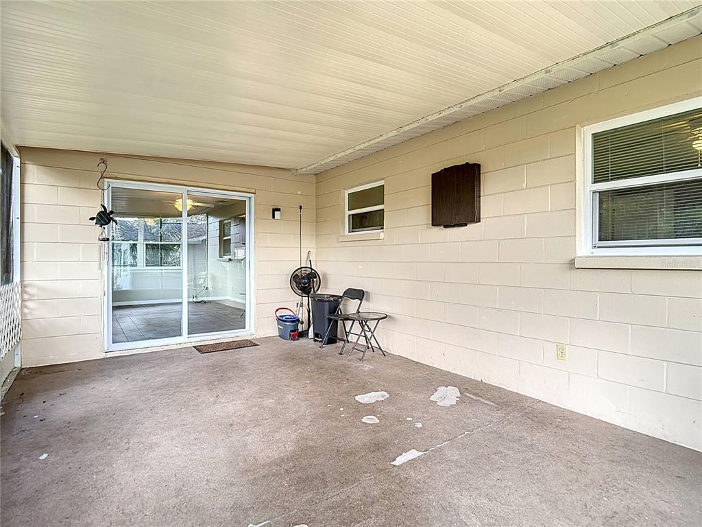 7318 Tranquil Drive Spring Hill, FL 34606 - Photo 29 of 31 a view of a livingroom with a patio and a yard