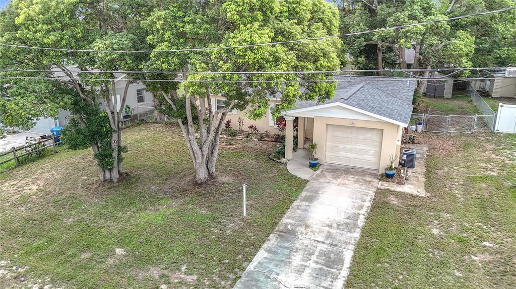 7318 Tranquil Drive Spring Hill, FL 34606 - Photo 30 of 31 a view of a house with a yard