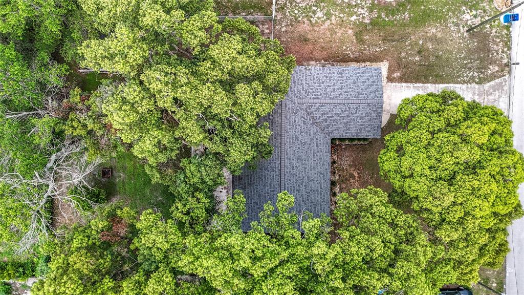 7318 Tranquil Drive Spring Hill, FL 34606 - Photo 36 of 38 an aerial view of a house with a yard and garden