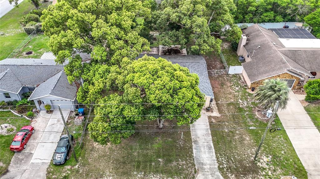 7318 Tranquil Drive Spring Hill, FL 34606 - Photo 38 of 38 an aerial view of a house with a yard