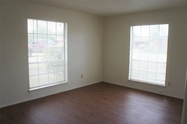 an empty room with wooden floor