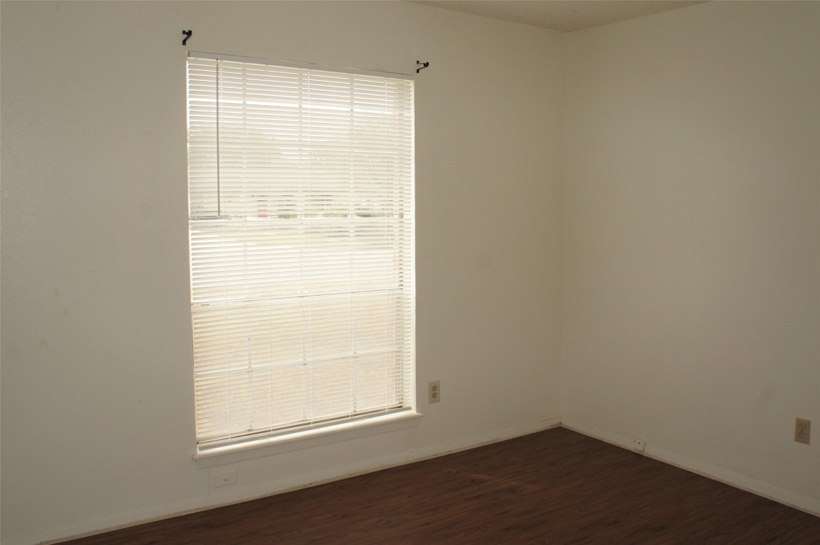 803 Power Road, Unit A Georgetown, TX 78628 - Photo 8 of 8 an empty room with a window