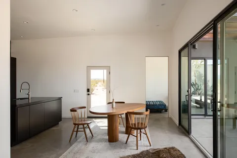 a living room with furniture and large window