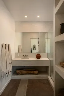 a bedroom with a bed and cabinets