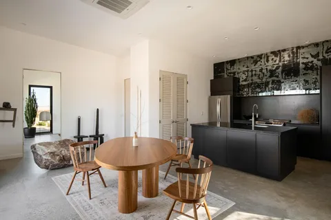 a kitchen with a refrigerator and a stove