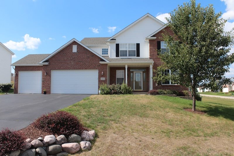 645 Merrion Road Roscoe, IL 61073 - Photo 1 of 24 a front view of house with yard and trees around