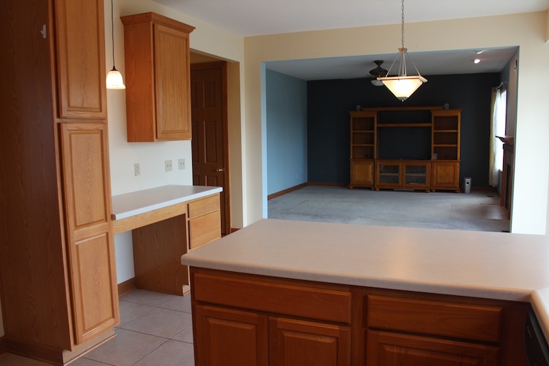 645 Merrion Road Roscoe, IL 61073 - Photo 11 of 24 a kitchen with a sink and a refrigerator