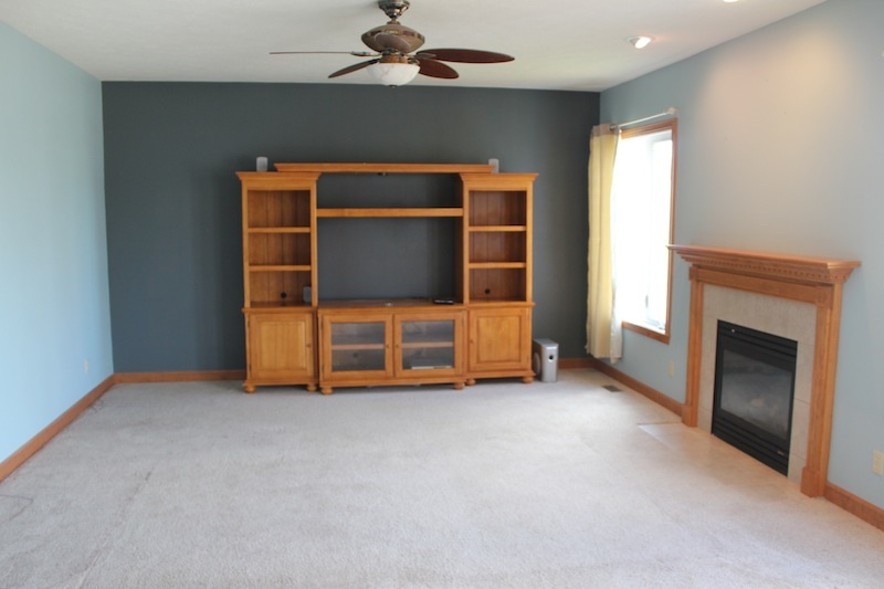645 Merrion Road Roscoe, IL 61073 - Photo 12 of 24 a view of an empty room with a fireplace