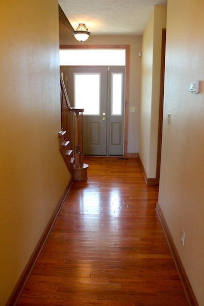 645 Merrion Road Roscoe, IL 61073 - Photo 13 of 24 an empty room with wooden floor and mirror