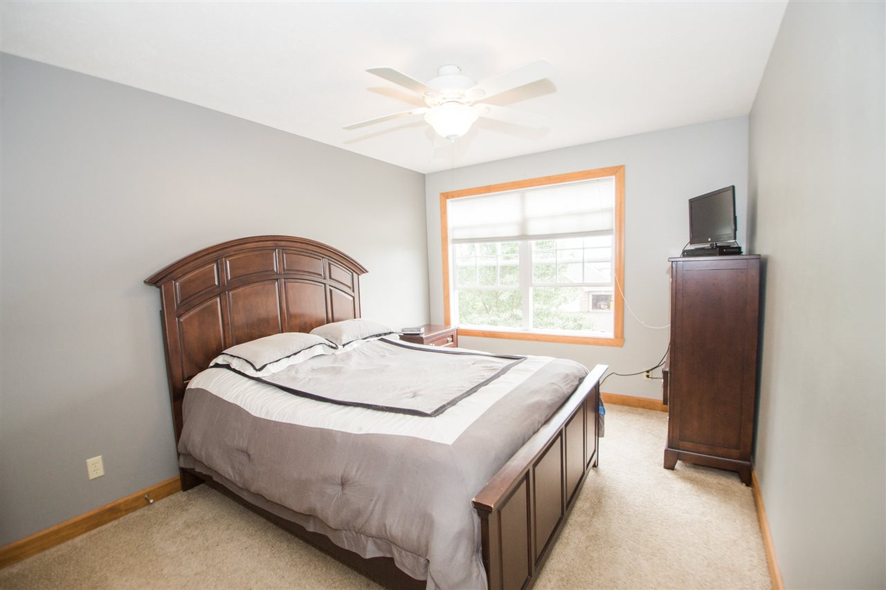 645 Merrion Road Roscoe, IL 61073 - Photo 18 of 24 a bedroom with a bed and a window