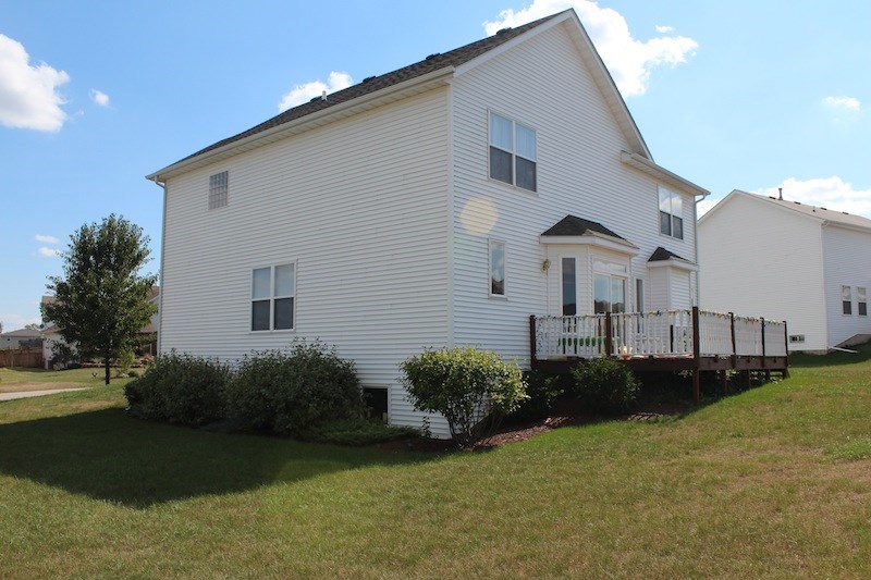 645 Merrion Road Roscoe, IL 61073 - Photo 24 of 24 a view of a house with backyard and garden