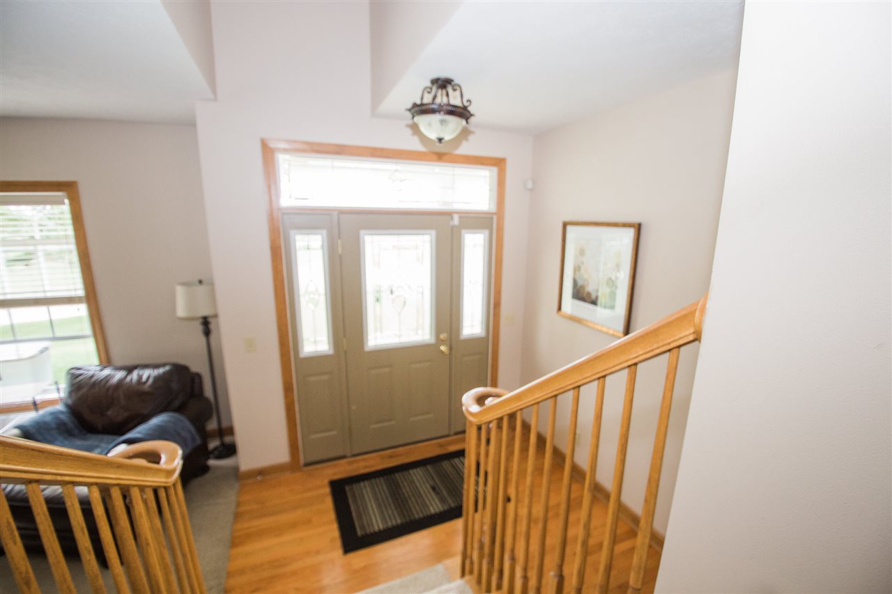 645 Merrion Road Roscoe, IL 61073 - Photo 3 of 24 a view of a hallway with a window