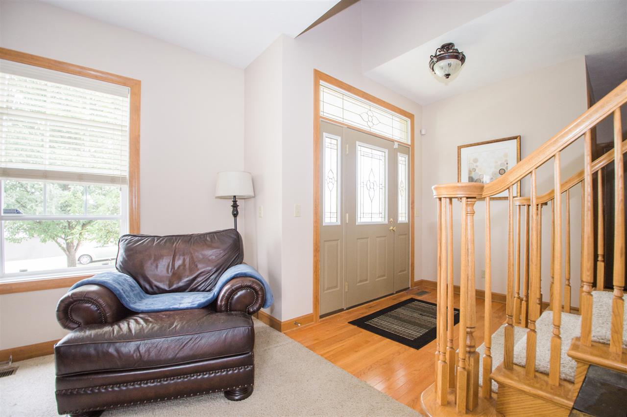 645 Merrion Road Roscoe, IL 61073 - Photo 4 of 24 a living room with furniture and a window