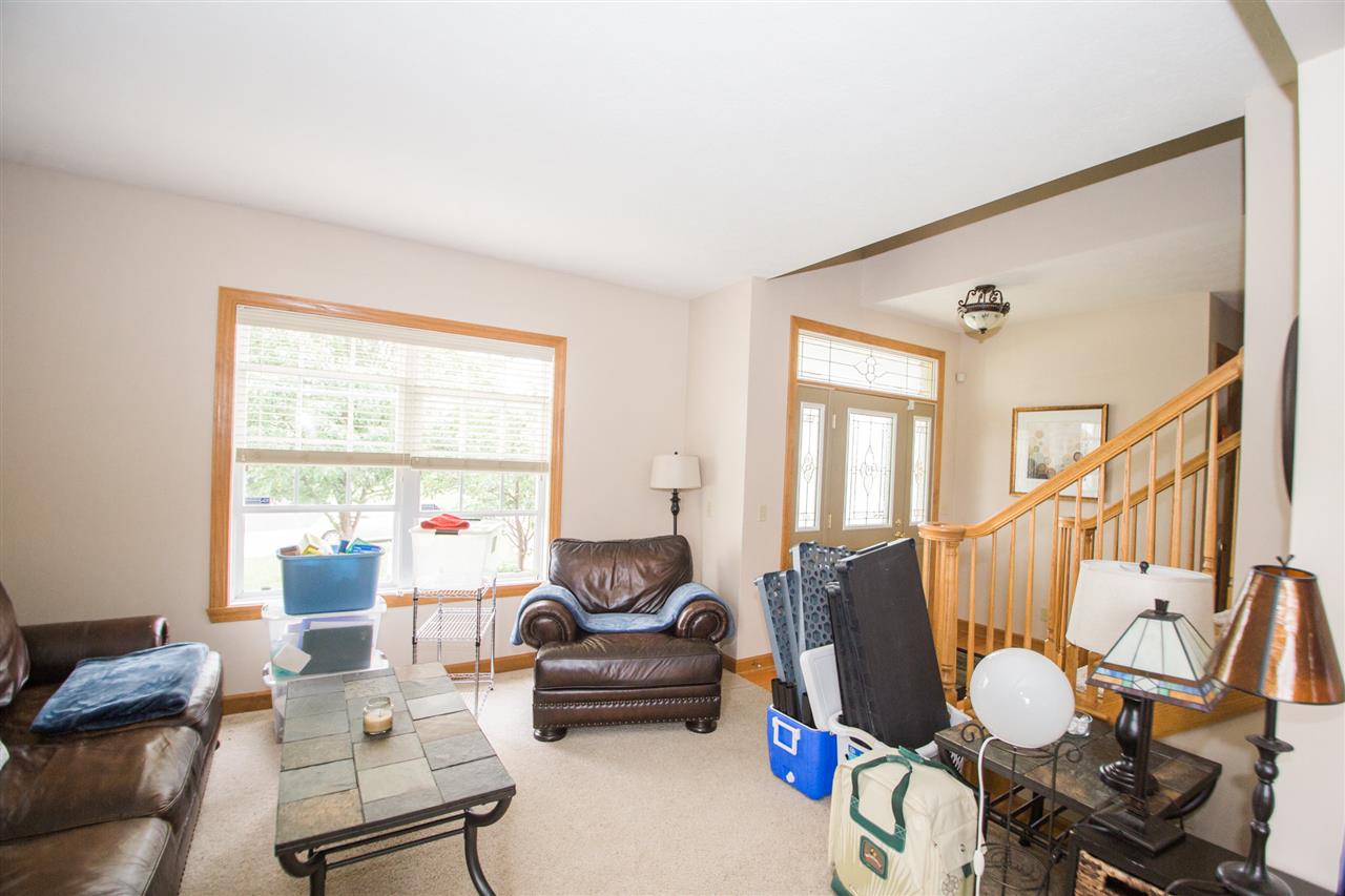 645 Merrion Road Roscoe, IL 61073 - Photo 5 of 24 a living room with furniture and a large window
