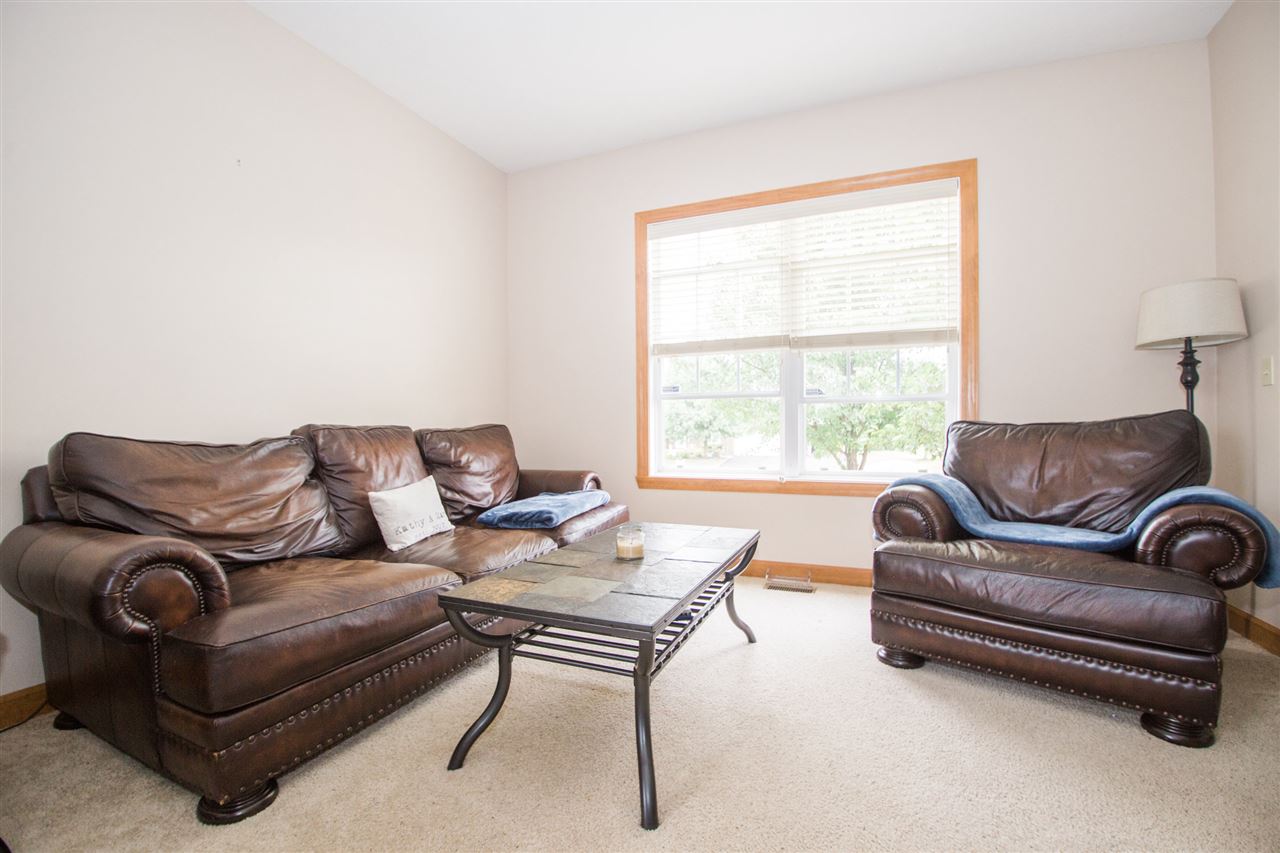 645 Merrion Road Roscoe, IL 61073 - Photo 6 of 24 a living room with furniture and a window