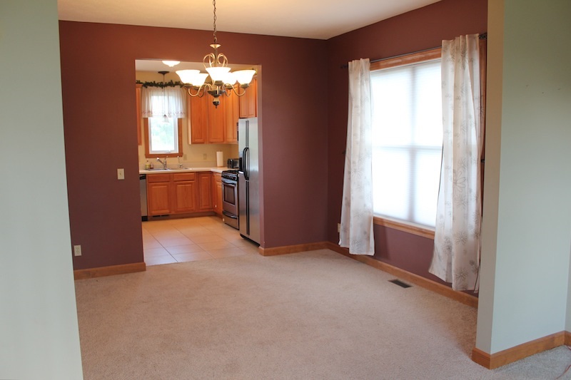 645 Merrion Road Roscoe, IL 61073 - Photo 7 of 24 a view of a room with a chandelier and a window