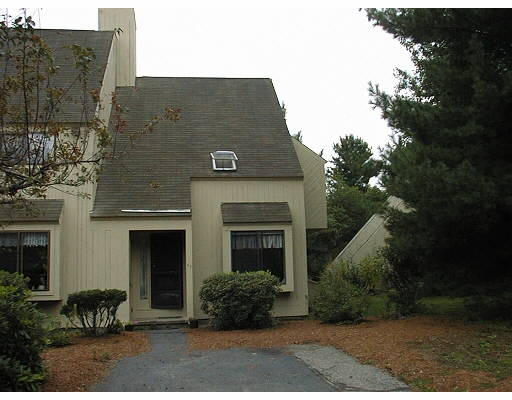 35 Hazen Road, Unit F7 Shirley, MA 01464 - Photo 1 of 1 a front view of a house with plants and garden