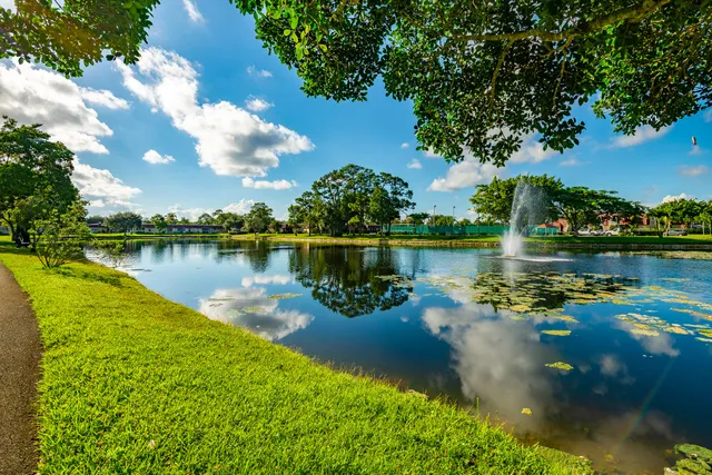 a view of a lake with a house in the background