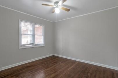 751 Yale Place Southwest Atlanta, GA 30315 - Photo 11 of 15 an empty room with wooden floor fan and windows
