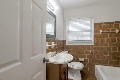 751 Yale Place Southwest Atlanta, GA 30315 - Photo 12 of 15 a bathroom with a sink a toilet and mirror