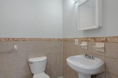 751 Yale Place Southwest Atlanta, GA 30315 - Photo 13 of 15 a bathroom with a sink a toilet and a mirror
