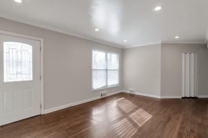 751 Yale Place Southwest Atlanta, GA 30315 - Photo 3 of 15 an empty room with wooden floor and windows with curtains view