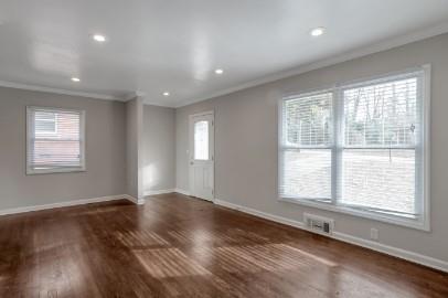 751 Yale Place Southwest Atlanta, GA 30315 - Photo 4 of 15 a view of an empty room with wooden floor and a window