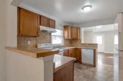 751 Yale Place Southwest Atlanta, GA 30315 - Photo 6 of 15 a kitchen with stainless steel appliances granite countertop a sink stove and cabinets