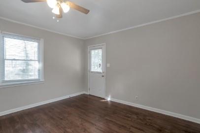 751 Yale Place Southwest Atlanta, GA 30315 - Photo 10 of 15 an empty room with wooden floor and windows
