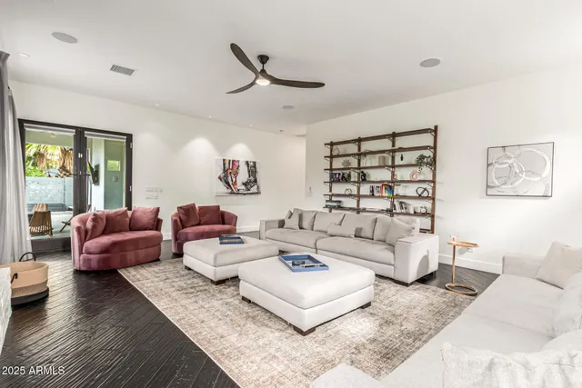 a bathroom with a tub a sink and a mirror
