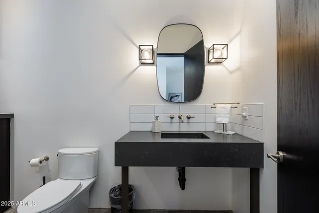 a bedroom with a bed and a walk in closet