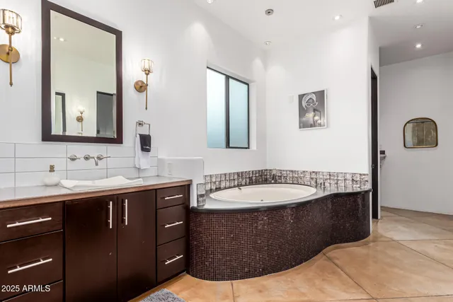a living room with furniture a piano and a bookshelf