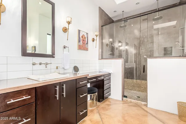 a view of a hallway with entryway and wooden floor