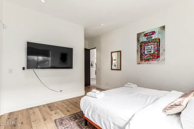 a view of a chair and table in backyard of the house