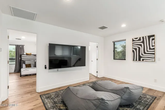 a view of a house with backyard porch and furniture