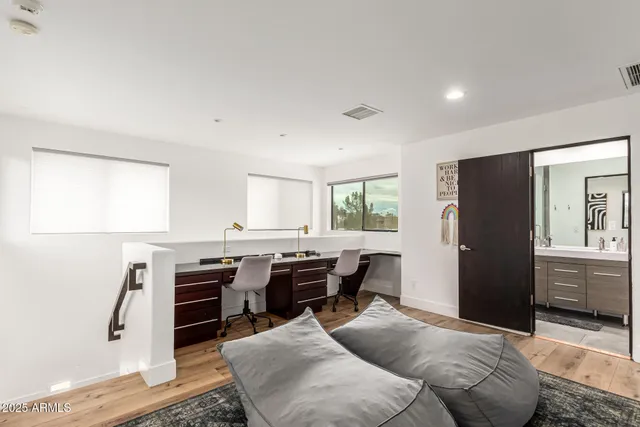 a view of a house with swimming pool and sitting area
