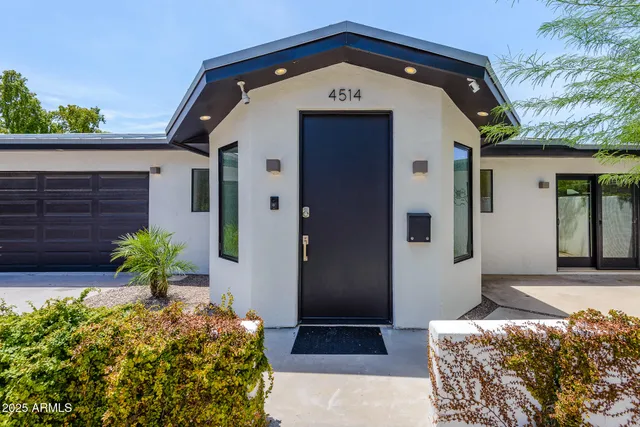 a kitchen with counter top space sink stove and refrigerator