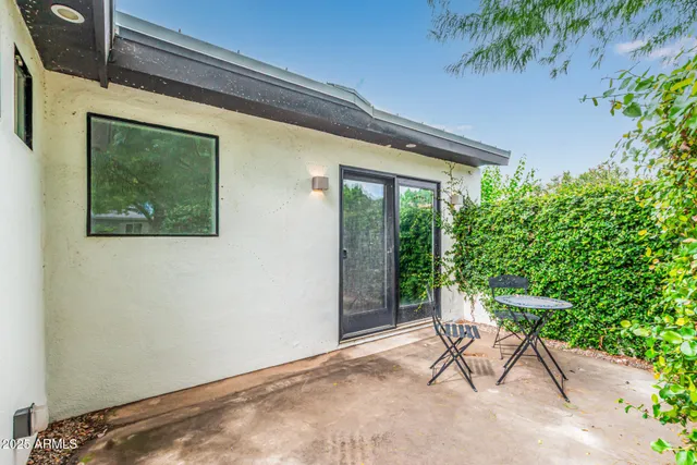 a kitchen with stainless steel appliances kitchen island granite countertop a sink and cabinets