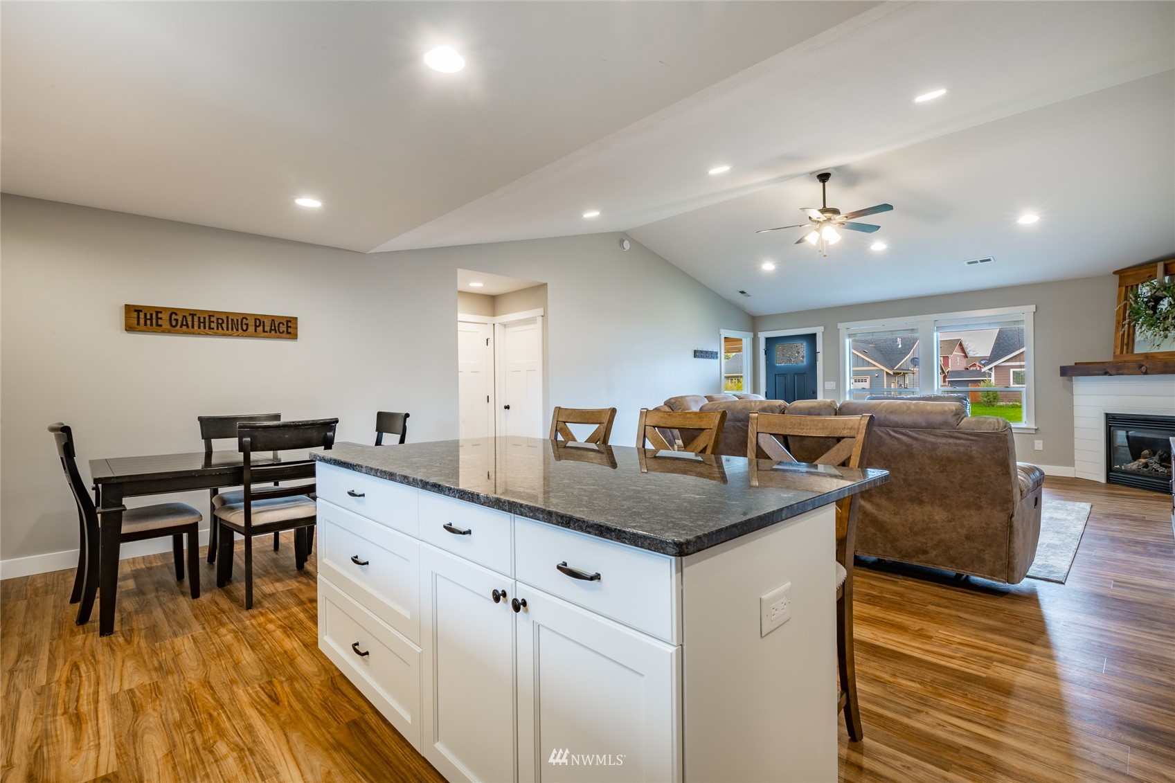 409 Amareen Court Nooksack, WA 98276 - Photo 12 of 35 a view of a kitchen counter top space with furniture and wooden floor