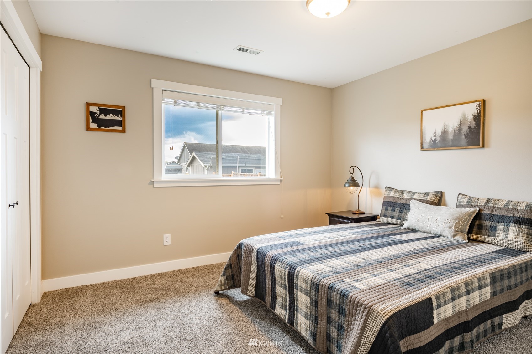 409 Amareen Court Nooksack, WA 98276 - Photo 14 of 35 a bedroom with bed and wall painting