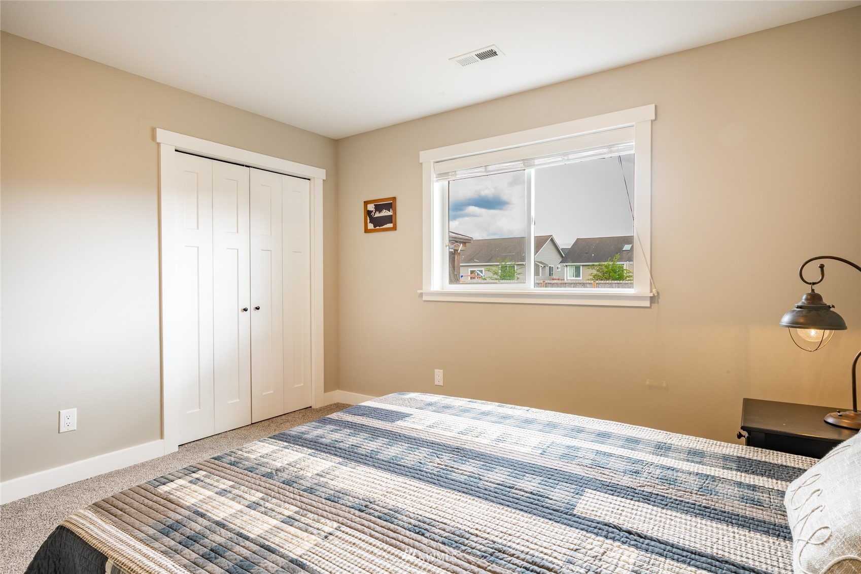 409 Amareen Court Nooksack, WA 98276 - Photo 18 of 35 a bedroom with a bed and a window