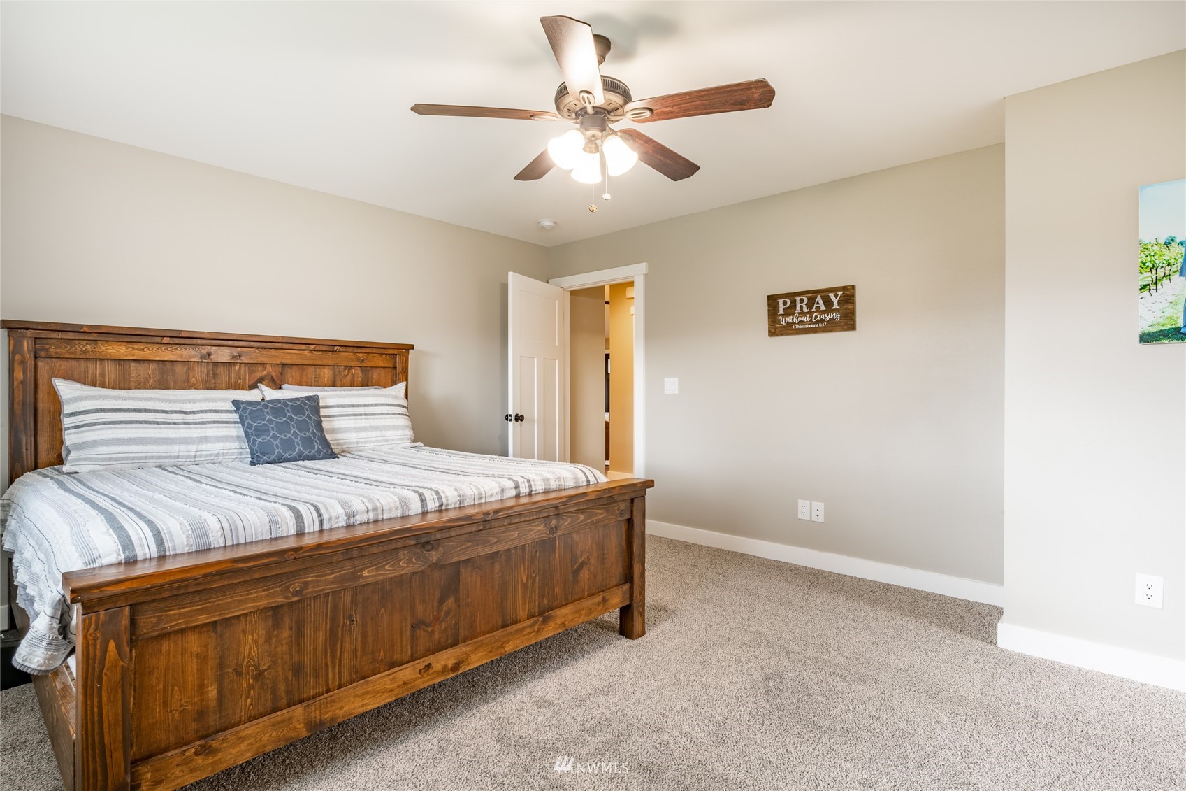 409 Amareen Court Nooksack, WA 98276 - Photo 21 of 35 a bedroom with a bed and a ceiling fan