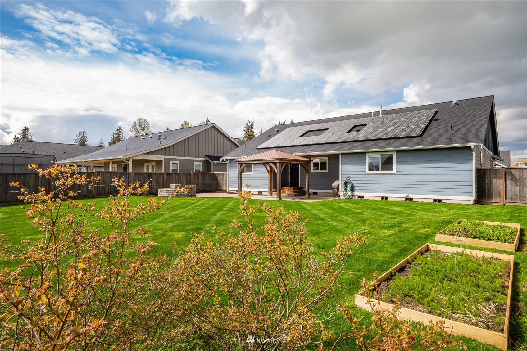 409 Amareen Court Nooksack, WA 98276 - Photo 25 of 35 a front view of a house with garden