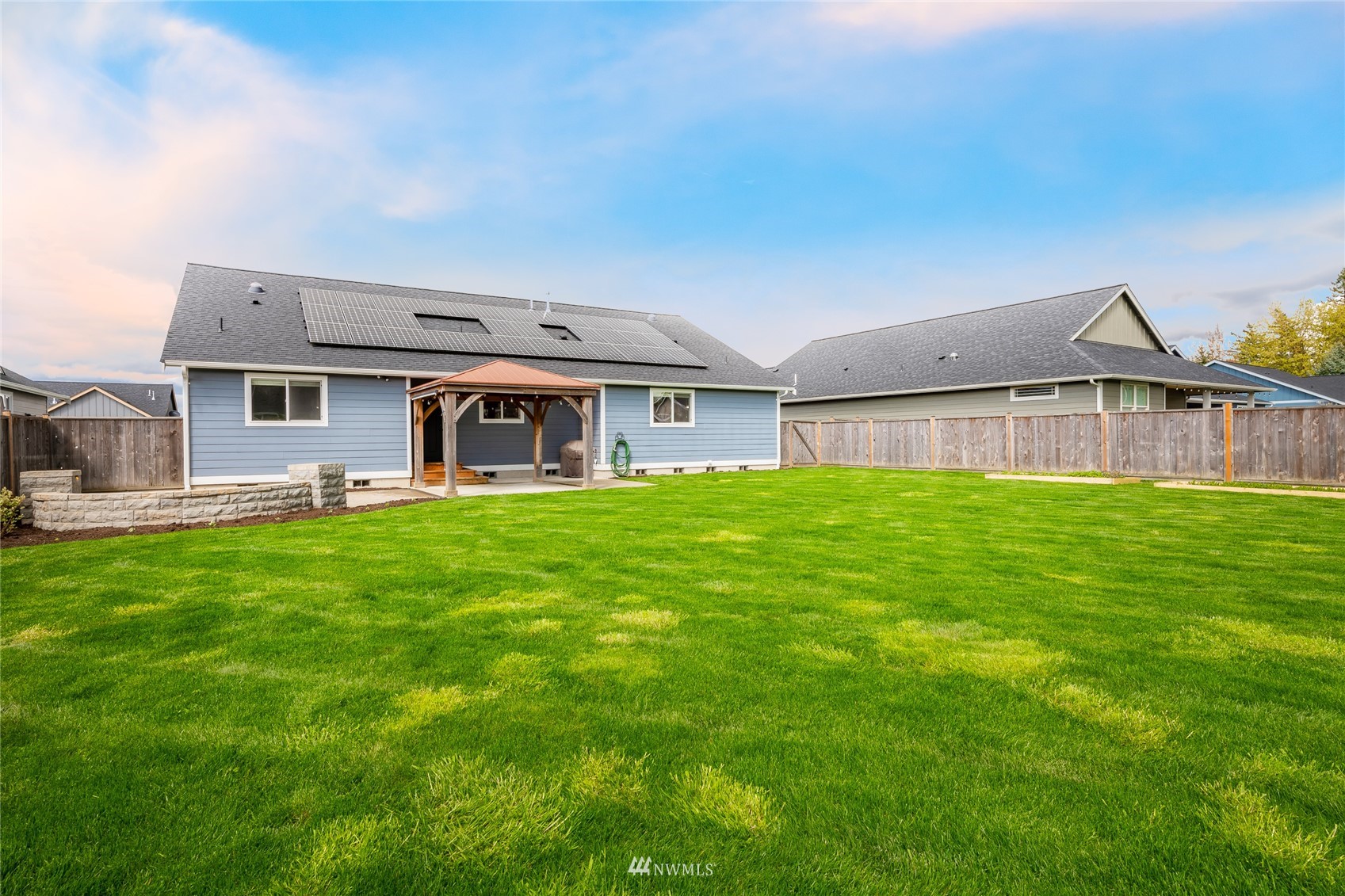 409 Amareen Court Nooksack, WA 98276 - Photo 26 of 35 a front view of house with yard barbeque and outdoor seating