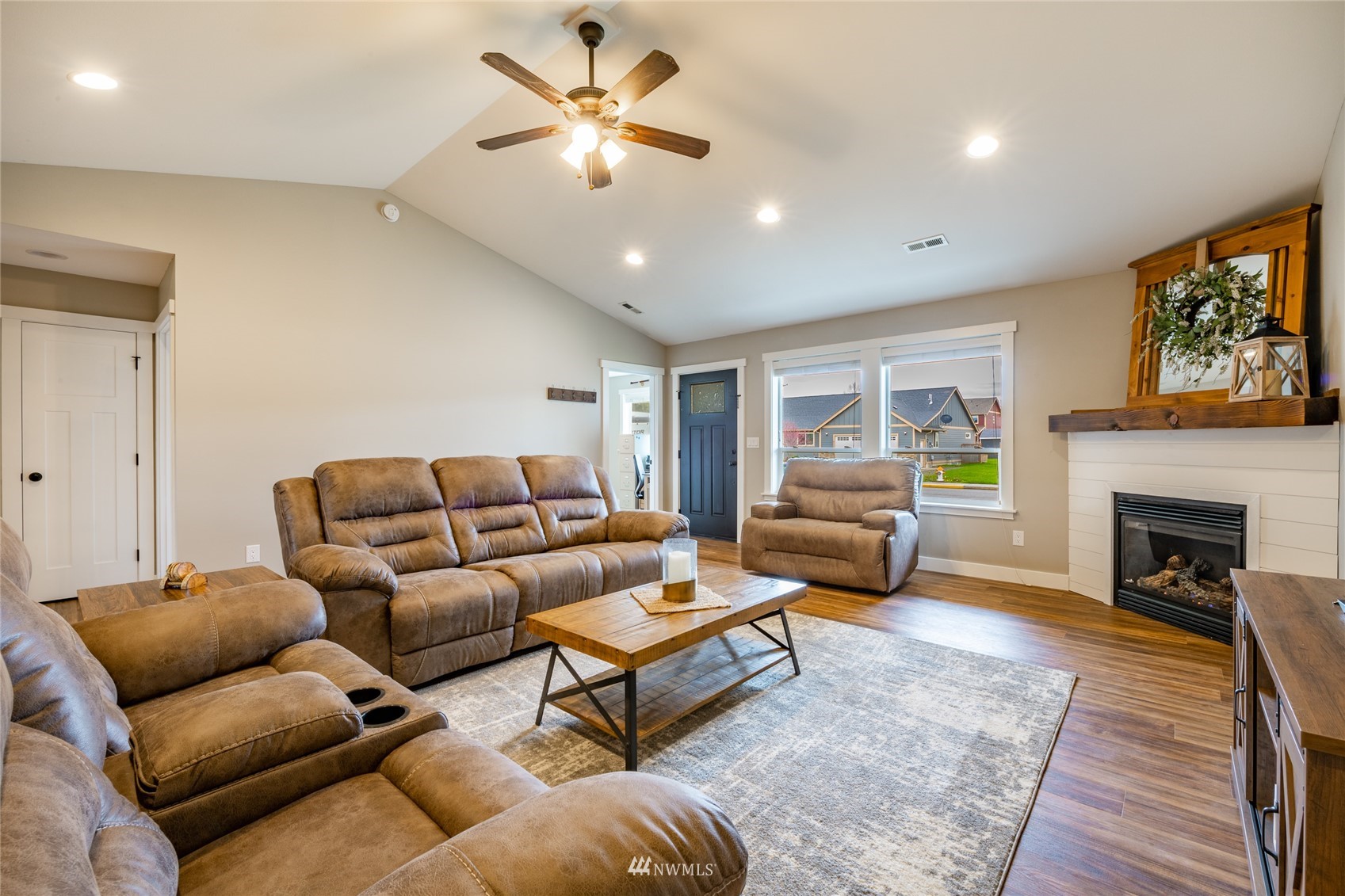 409 Amareen Court Nooksack, WA 98276 - Photo 3 of 35 a living room with furniture and a fireplace