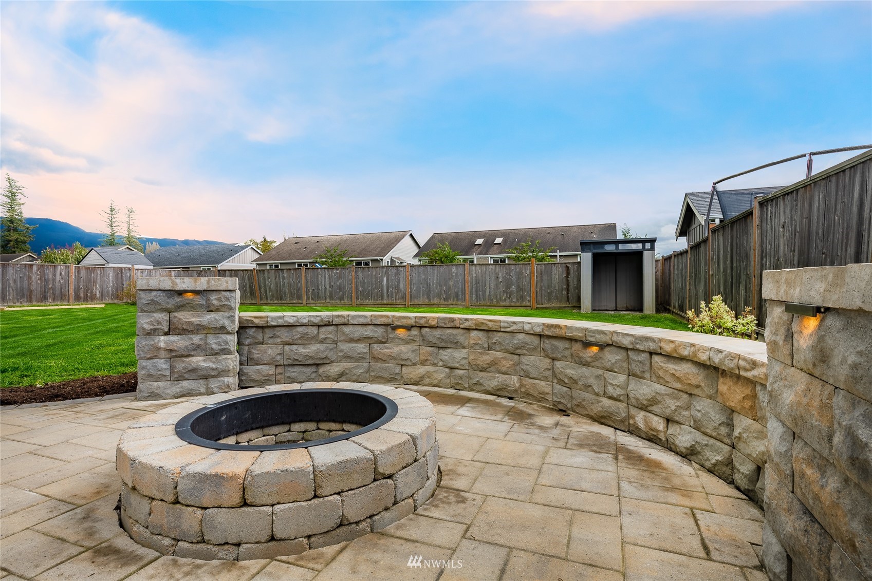 409 Amareen Court Nooksack, WA 98276 - Photo 32 of 35 a swimming pool with an outdoor seating