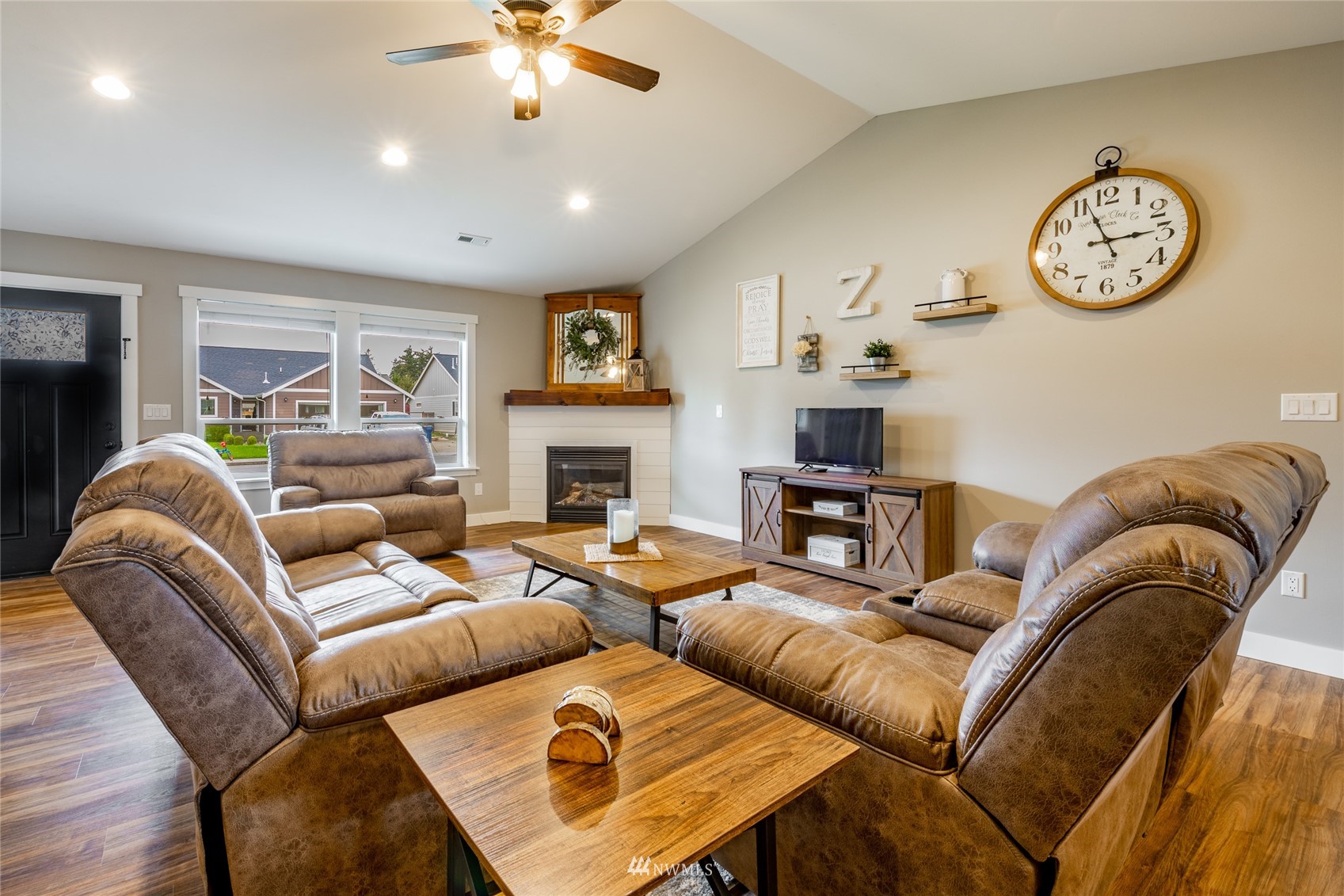 409 Amareen Court Nooksack, WA 98276 - Photo 4 of 35 a living room with furniture a fireplace and a window