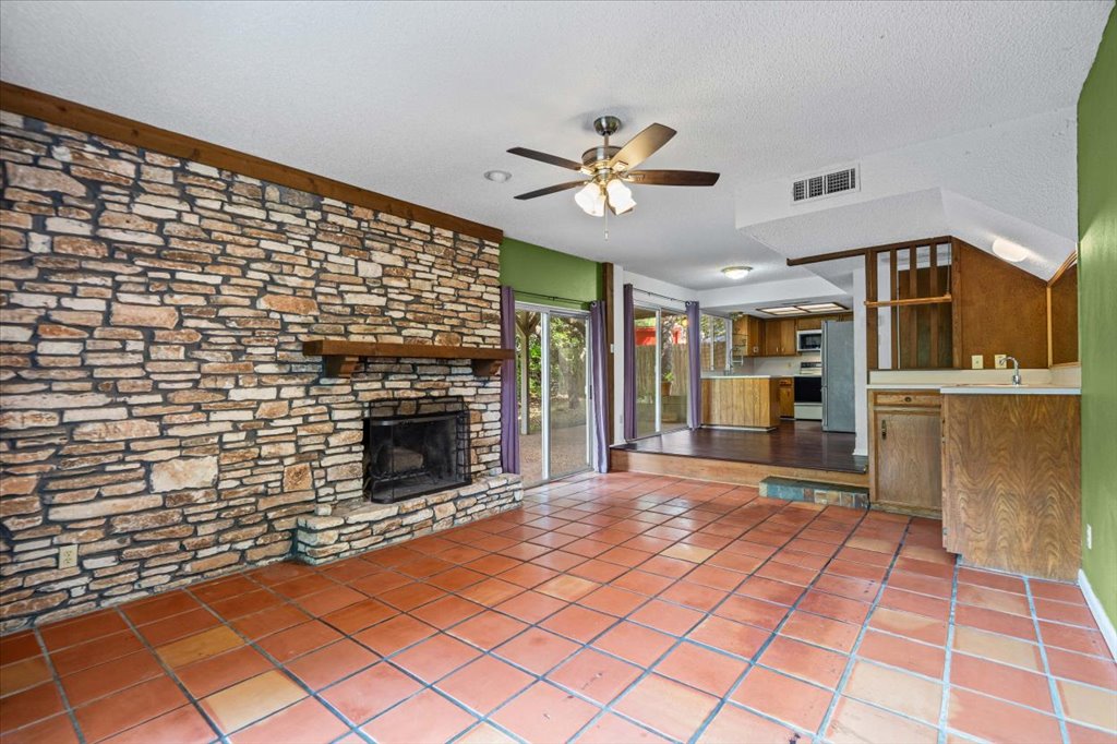 7229 South Brook Drive Austin, TX 78736 - Photo 2 of 20 With amazing stone wall, wood fireplace, wet bar.